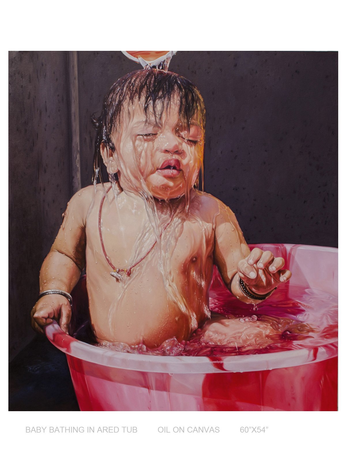 Baby bathing in a Red Tub
